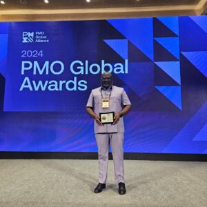 Mr. William Tetteh, Chief Capital Projects Officer Showcasing The Award Received At The Pmo Global Alliance Uncon Event In Turkey